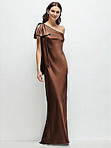 Front View Thumbnail - Cognac One-Shoulder Bias-Cut Satin Maxi Dress with Cascading Shoulder Bow