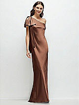Front View Thumbnail - Cognac One-Shoulder Bias-Cut Satin Maxi Dress with Cascading Shoulder Bow