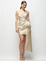 Alt View 1 Thumbnail - Champagne Strapless Pleated Draped Satin Mini Dress with Dramatic Long Tail Bow & Covered Buttons