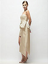 Side View Thumbnail - Champagne Strapless Pleated Draped Satin Mini Dress with Dramatic Long Tail Bow & Covered Buttons