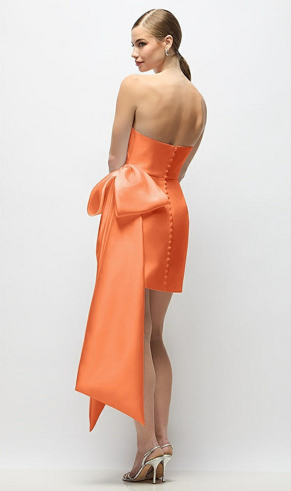 Back View - Portofino Orange Strapless Pleated Draped Satin Mini Dress with Dramatic Long Tail Bow & Covered Buttons